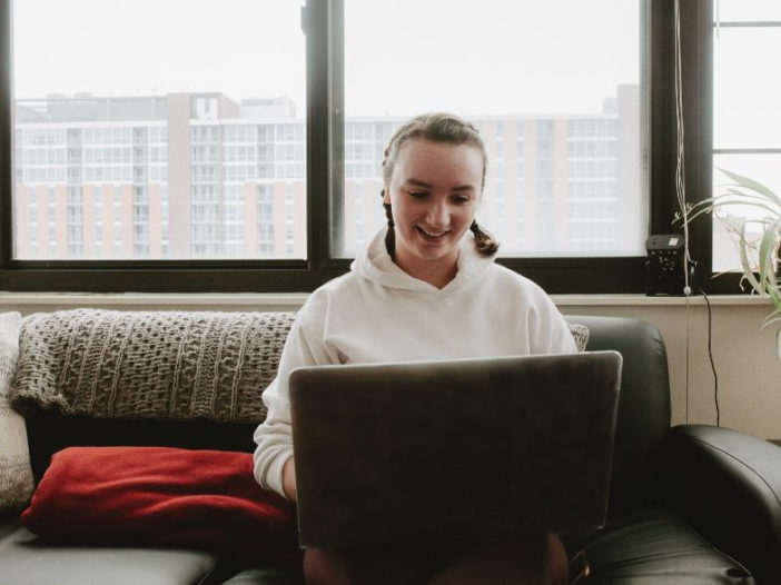 girl on computer smiling