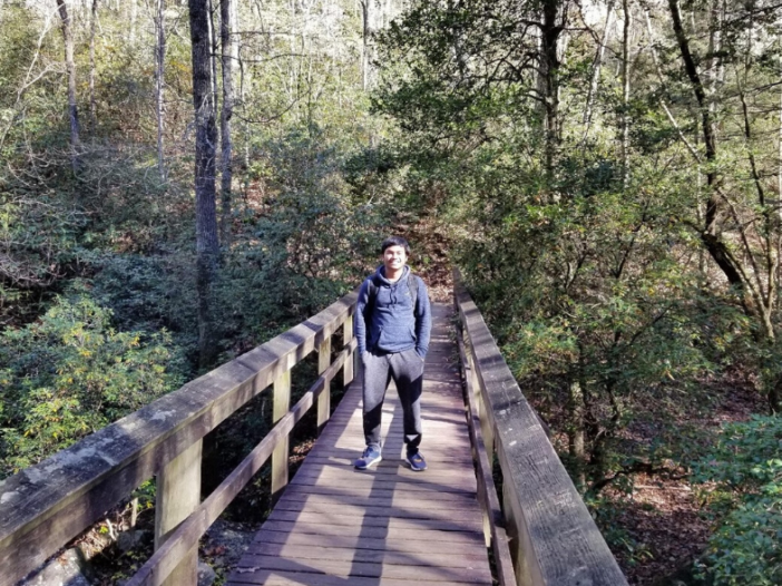 Candid Student hiking outside