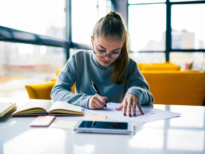 student working on finances